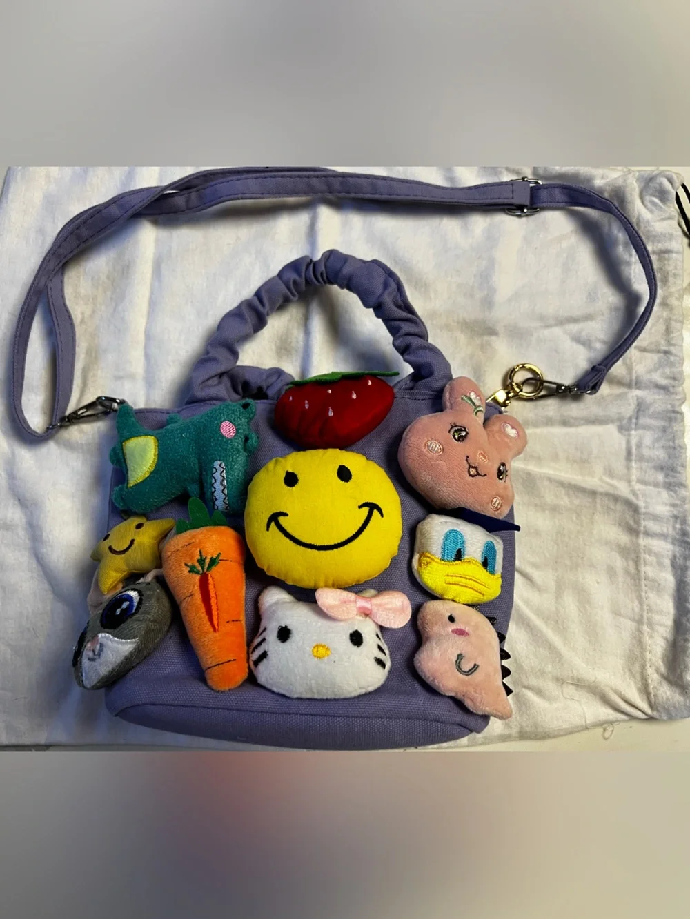 Lola and the Boys purple tote with attached plushies